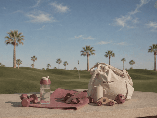 motherhouse workout gear flat lay with palm trees in Las Vegas